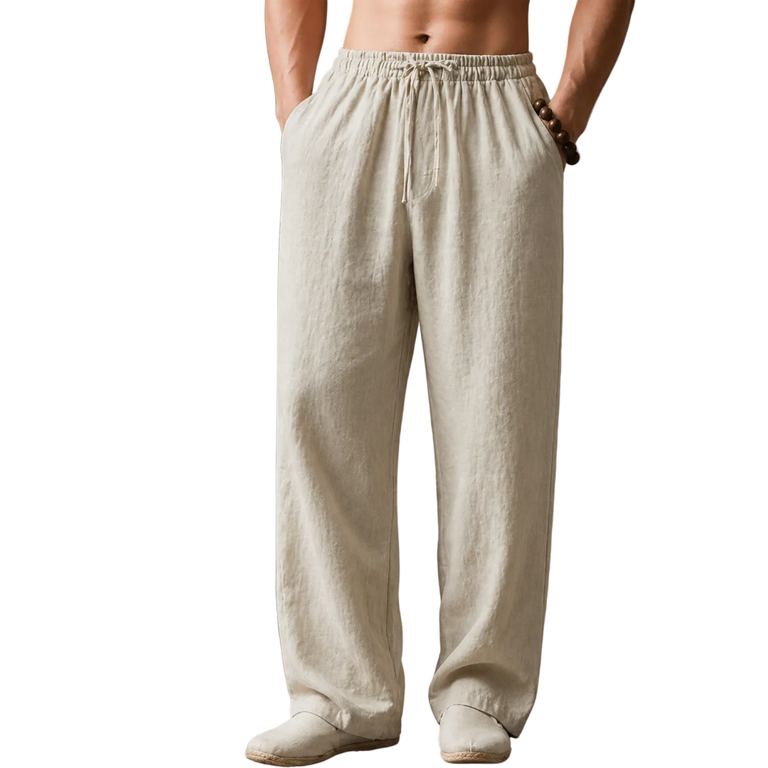Person wearing beige linen pants against a white background
