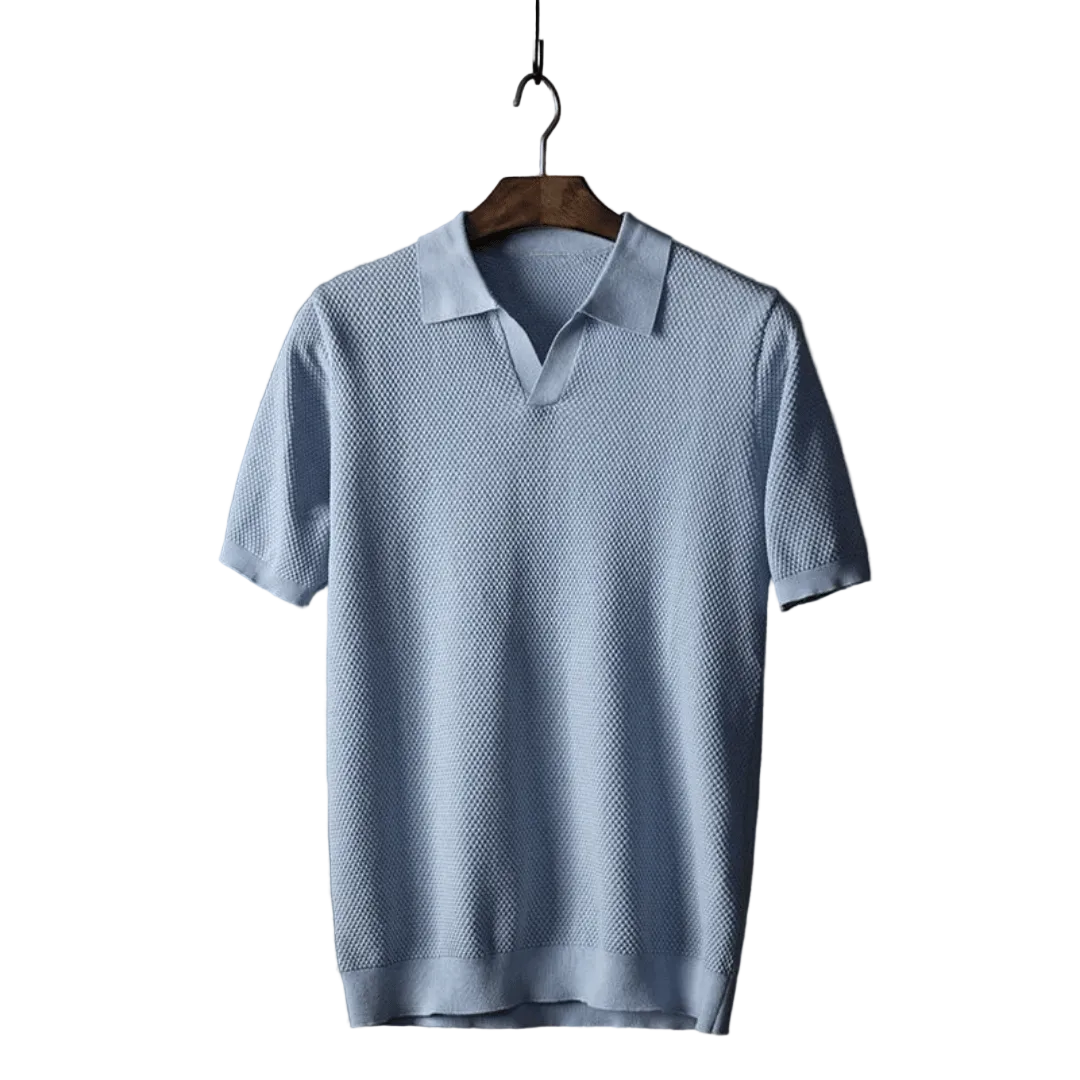 Light blue polo shirt on a wooden hanger against a white background