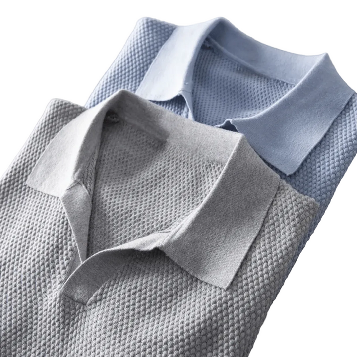 Two textured shirts, one gray and one light blue, on a white background.