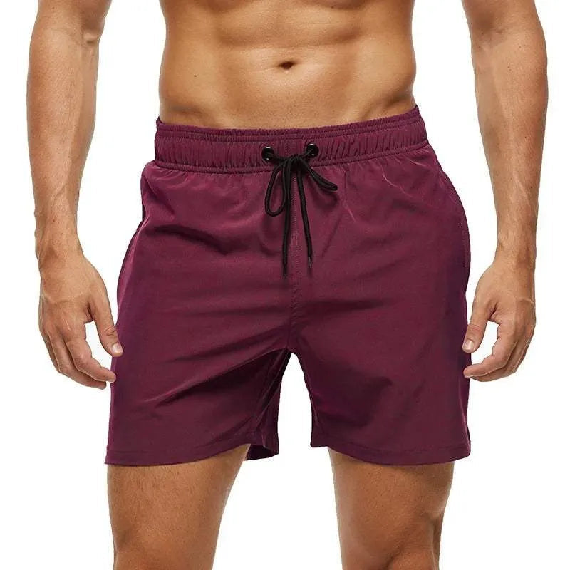 Maroon shorts with a drawstring on a white background