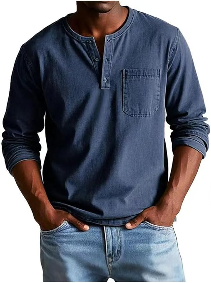 Man wearing a blue long-sleeve henley shirt and light blue jeans on a white background