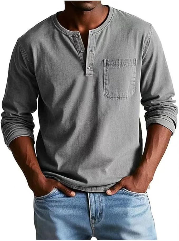 Man wearing a gray long-sleeve henley shirt and blue jeans on a white background