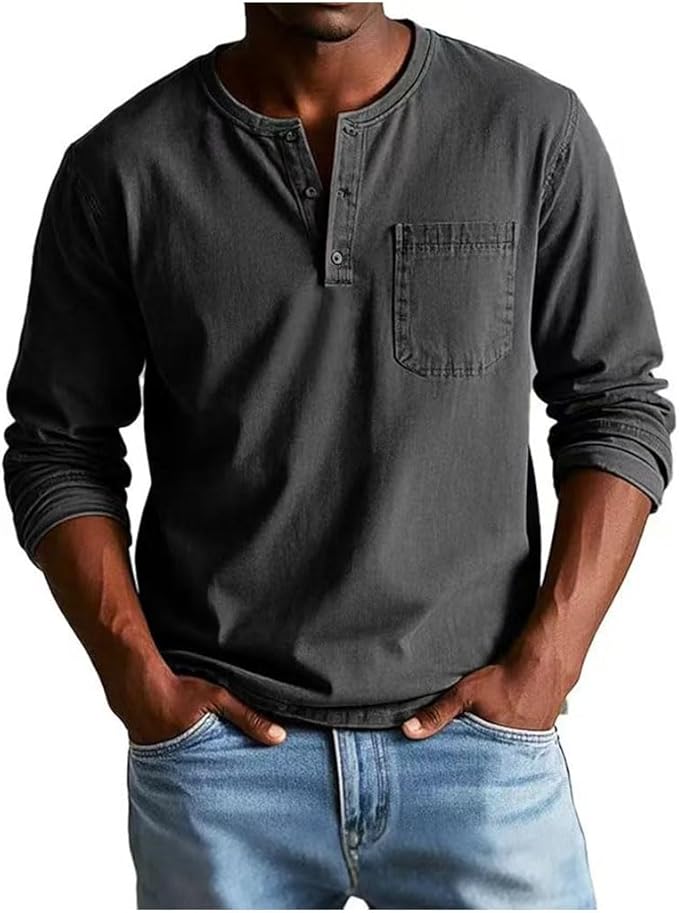 Man wearing a dark gray long-sleeve henley shirt with a pocket, paired with light blue jeans on a white background.