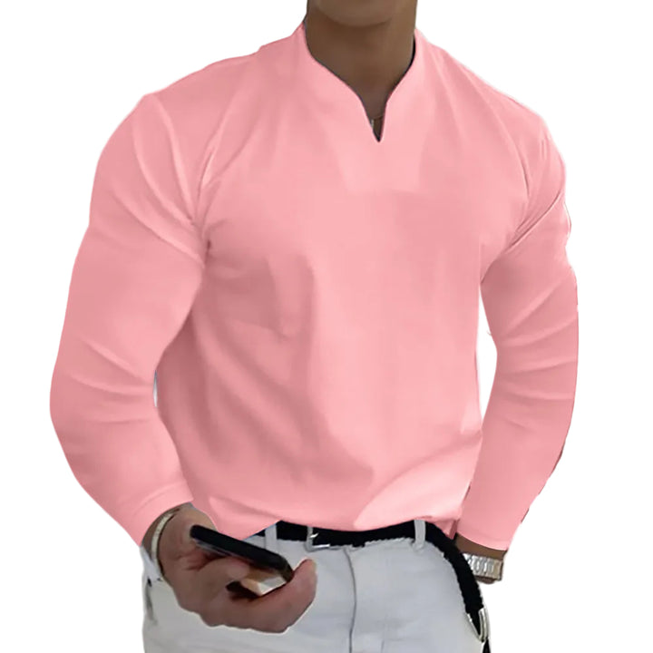 Person wearing a pink long-sleeve shirt with a white background