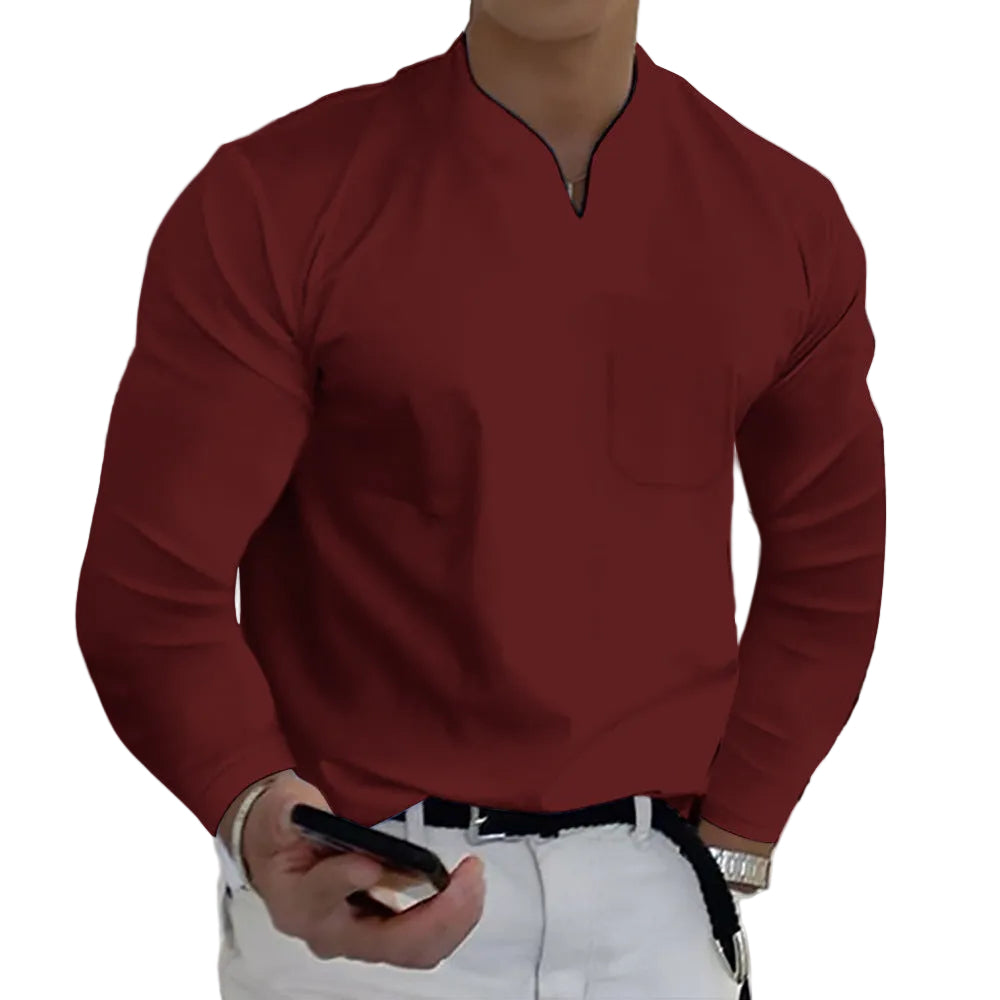 Person wearing a red long-sleeve shirt and white pants, holding a phone.