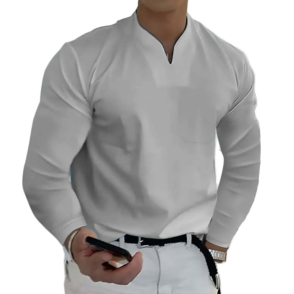 Person wearing a light gray long-sleeve shirt with a white background