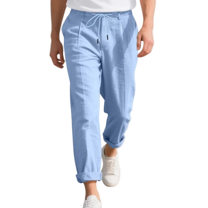 Light blue pants worn by a person on a white background