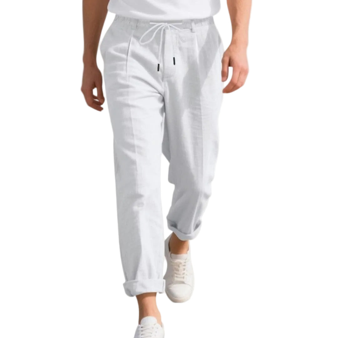 White pants worn by a person on a white background