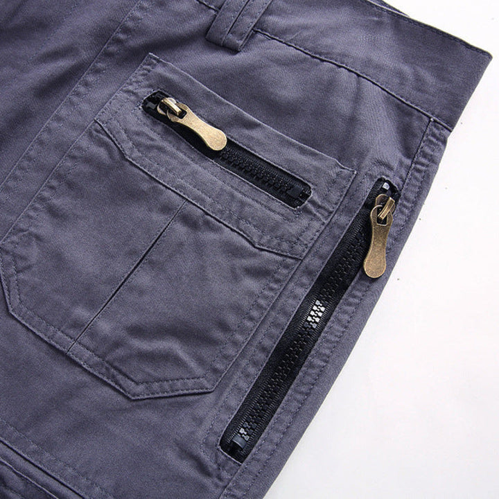 Close-up of gray pants with zippers on a white background