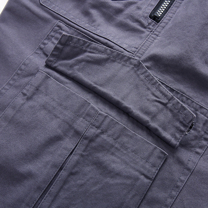 Close-up of dark gray pants with a zipper detail.