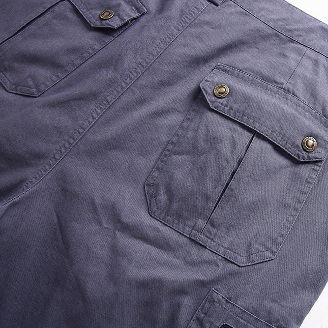 Close-up of a navy blue shirt with buttoned pockets