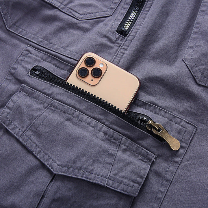 Gold phone case with black zipper pocket on a gray jacket
