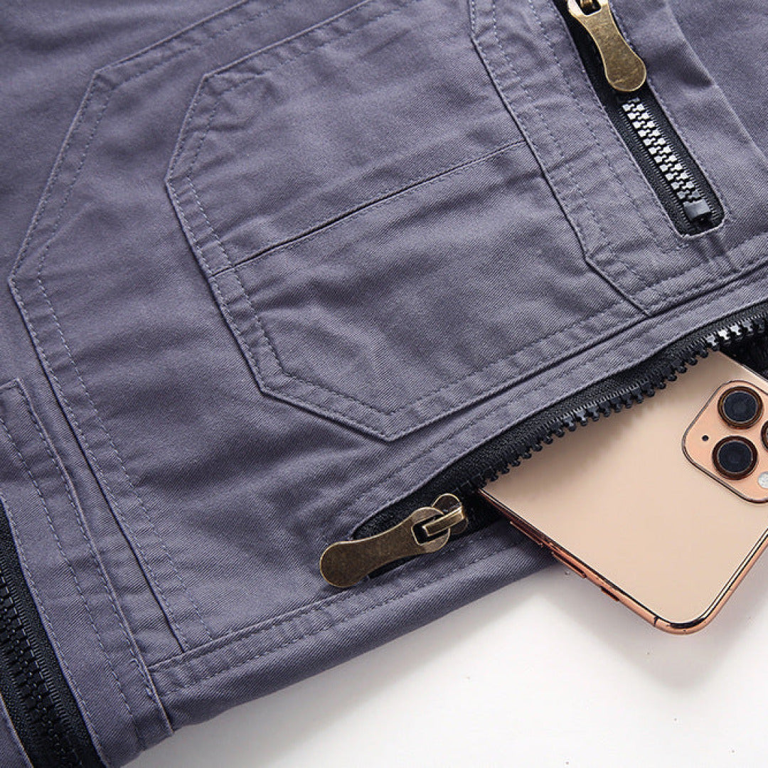 Phone in a pocket of a gray jacket on a white background