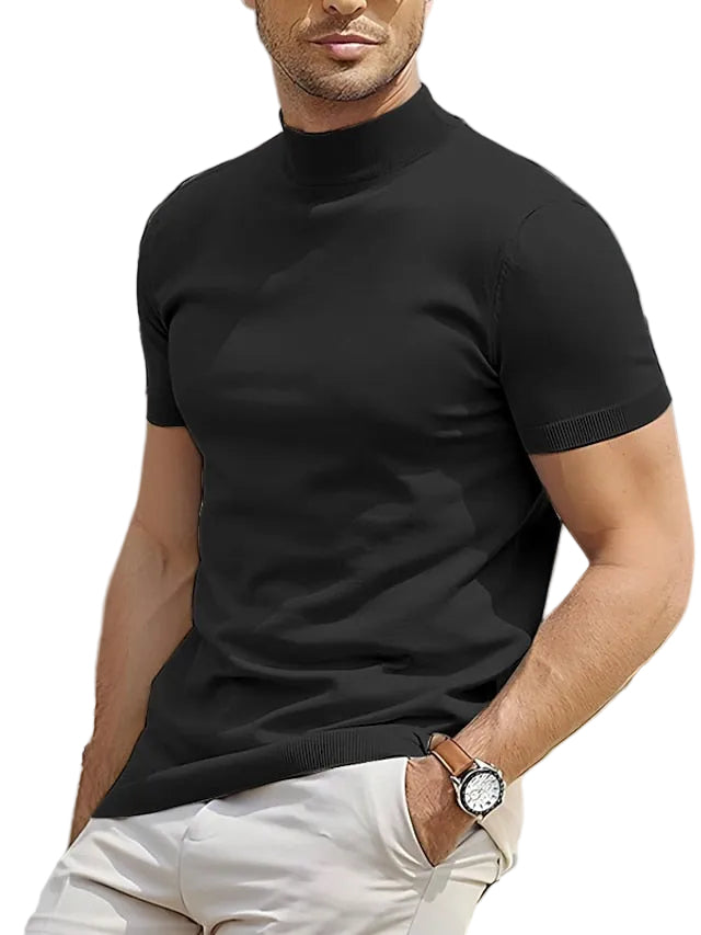Man wearing a black turtleneck sweater and white pants in white background