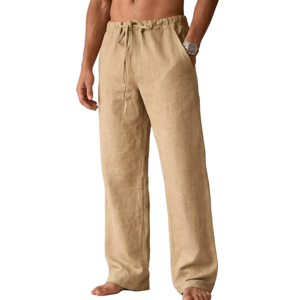 Beige linen pants worn by a person on a white background