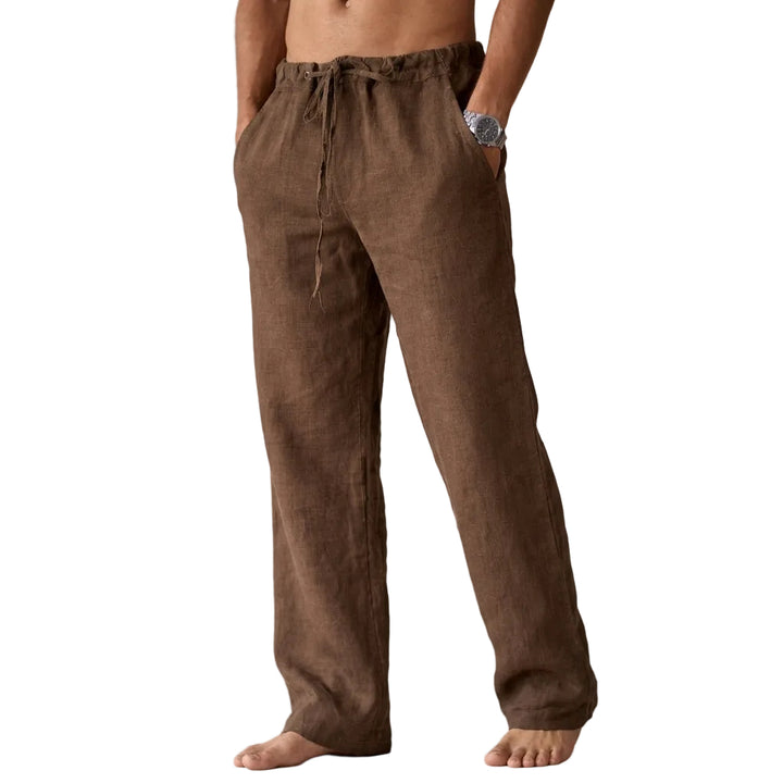 Brown linen pants worn by a person on a white background