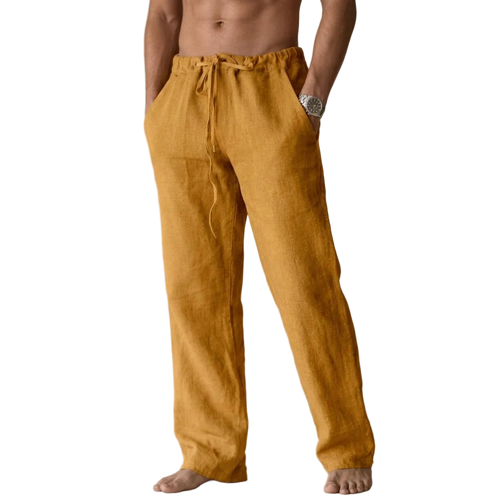 Mustard yellow linen pants worn by a person on a white background